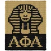 Alpha Phi Alpha Sphinx Knit Blanket Pattern, a golden pharaoh sphinx face in a striped nemes headdress above the greek letters Alpha Phi Alpha, worked in stockinette colorwork intarsia with 2 colors: Black and Gold.