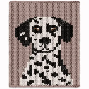 Dalmatian Dog Finger Knit Blanket Pattern - a black-and-white Dalmatian puppy with long floppy ears and brown eyes on a truffle background, knitted in stockinette colorwork intarsia with 4 colors: Truffle, Ivory, Black, Brown.