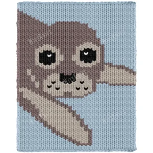 Baby Seal Blanket Finger Knitting Pattern - a cute baby fur seal with a round gray head, big dark eyes with white highlights, a silver muzzle with a black nose and whisker dots, and a front flipper on a sky blue background, knitted in stockinette colorwork intarsia with 5 colors: Sky, Gray, Silver, Black, and White.