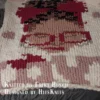Love Yourself Finger Knit Blanket Pattern - motivational self-love portrait of an African American Black woman with an afro bun, a royal blue headband with a bow, blue glasses, gold hoop earrings and burgundy lips, above the word LOVE with floating hearts on a white background, knitted in stockinette colorwork intarsia with 8 colors: White, Royal Blue, Cornflower, Brown, Camel, Black, Gold, Burgundy.